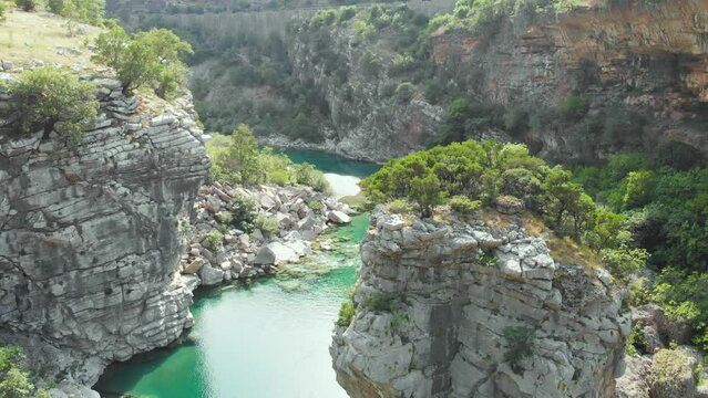 Aerial video of the mountain Moracha River canyon in Montenegro. Relax natural scenery, wild nature landscape, towering cliffs, clear river, green tourism, wanderlust.