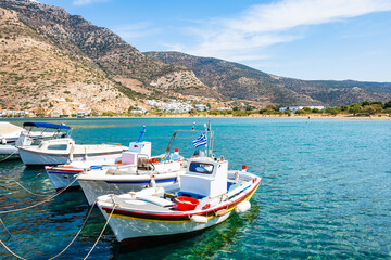 Traditional fishing boat anchoring in Kamares port, Sifnos island, Greece