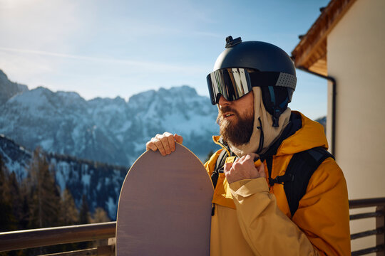 Portrait of a geared up snowboarder