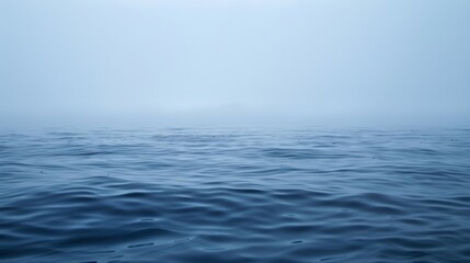 A misty ghostlike haze rises from the ocean surface making it difficult to see the horizon.