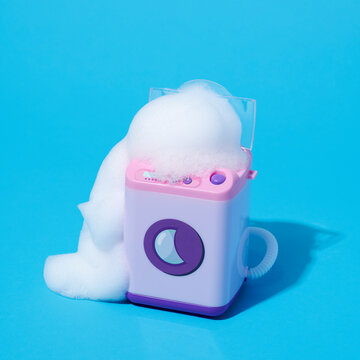 soap suds emerging from a toy washing machine