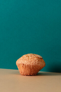 plain muffin placed on a brown surface
