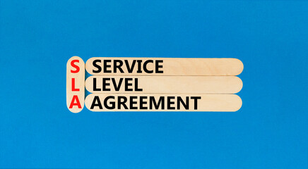 SLA service level agreement symbol. Concept words SLA service level agreement on beautiful wooden...