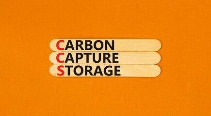 CCS Carbon capture storage symbol. Concept words CCS Carbon capture storage on beautiful wooden stick. Beautiful orange background. Business ecological Carbon capture storage concept. Copy space.