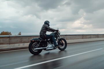 A man riding a motorcycle on a highway, suitable for travel and transportation concepts