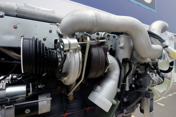 A close-up of the turbocharger installed on the engine. An engine component necessary to increase power.
