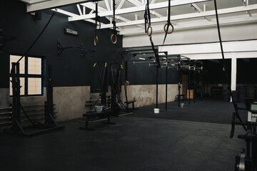 Interior of spacious modern gym with functional training equipment