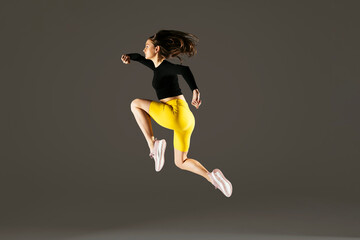 Woman jumping in studio