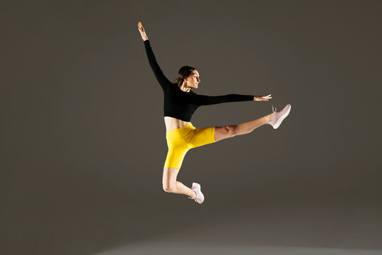 Woman jumping in studio