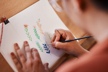 Drawing, artist or painter with canvas and brush for talent expression, creative art and relaxing on weekend. Person, craft or project creation for professional display, decoration or gallery