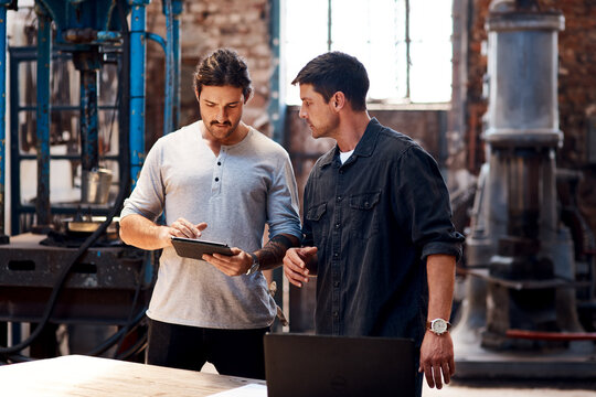 Tablet, manufacturing or people in workshop for blacksmith planning or warehouse trade in small business. Teamwork, research or metal workers in factory on technology for production or steel industry - Powered by Adobe