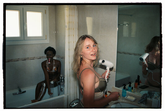 Girls doing morning routine in bathroom