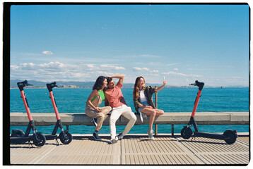 Friends making selfie near sea