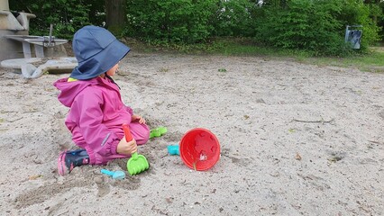 child playing on the sand