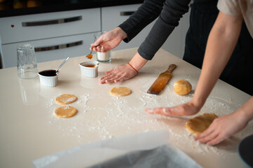 Hands Turn dough out and add jam