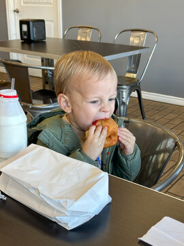 Child Eating Doughnut