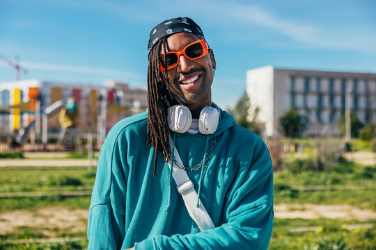Stylish young man enjoying a sunny day outdoors