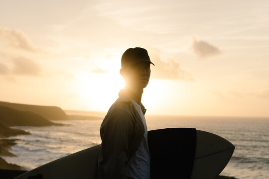 A skilled surfer is scouting for the perfect waves to surf