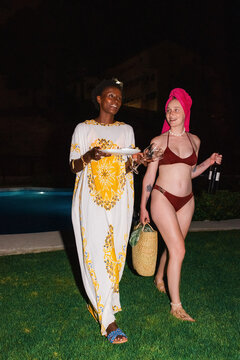 Young women coming home after swimming pool