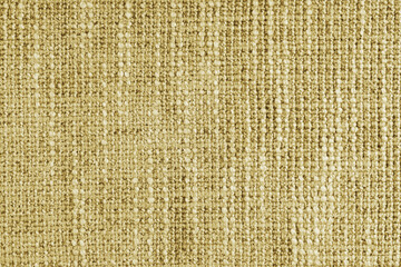 Jacquard woven coarse weave texture upholstery yellow fabric. Textile background, furniture textile material, wallpaper, backdrop. Cloth structure close up, macro.