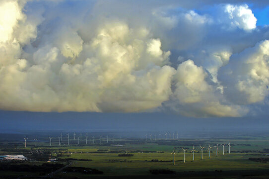 Aerial view of wind turbines under dramatic clouds in Os&oacute;rio, Rio Grande do Sul, Brazil