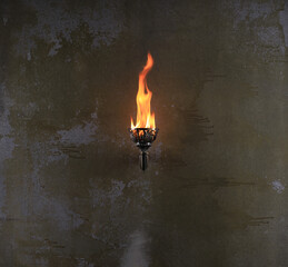 ancient torch on an old wall