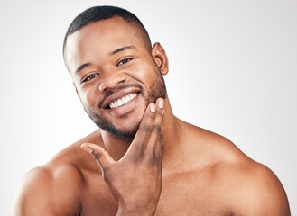 Skincare, portrait and black man in studio for wellness, healthy skin and pamper with cosmetics....