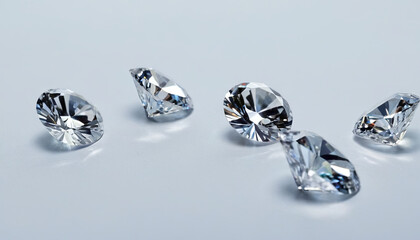 Multiple sparkling diamonds arranged neatly on a table surface