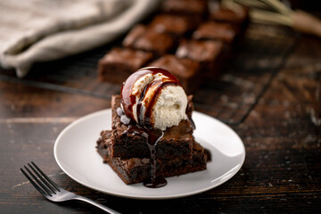 vanilla ice cream on chocolate brownie