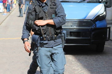 Riot police officer in riot gear with bulletproof vest during a protest demonstration in the city...