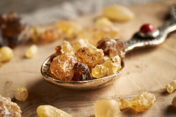 Frankincense resin on a spoon on a table, close up