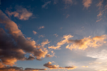 Colorful cloudscape at dusk, vibrant sunset sky for background use