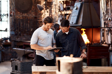 Men, blacksmith and tablet in workshop on teamwork for research and collaboration. Small business,...