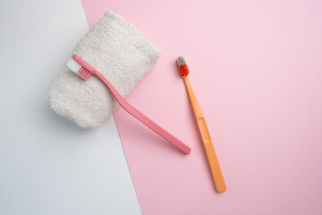 Colored toothbrushes on a color background. Replace your old toothbrush with a new one. Old and new toothbrushes. Dental health and hygiene concept