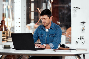 Laptop, engineer and man metal worker in workshop typing email for industrial project order....