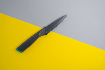 Kitchen knife on a colored background. Kitchen utensils and cooking concept