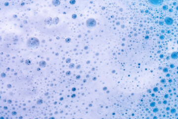 Detergent foam bubble on water. Blue background, Soap sud