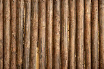 Detail of a wall made of wooden logs insulated with plaster