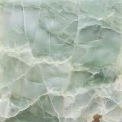 A slab of Ice Jade marble, capturing the ethereal beauty of its pale green background interspersed with wisps of white, resembling frozen water.