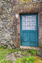 Blue door on a stone building.