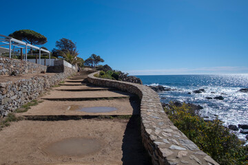 Fototapeta premium Coastal walkway path at the edge of a cliff in Costa Brava, Catalonia
