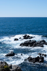 Quiet waves on rock cliffs in a beautiful seascape in Costa Brava, Catalonia, Mediterranean Sea