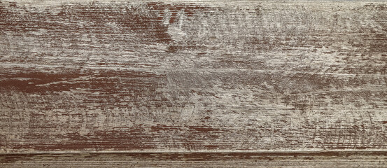 Texture of the old wooden broad panel covered with peeled off brown paint as a background