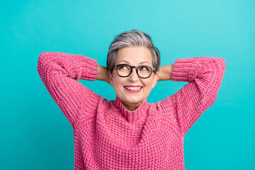 Photo of satisfied person dressed knitwear sweater in glasses look at sale empty space arms behind...