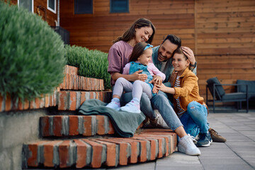 Happy family enjoying in time they are spending together in  backyard.