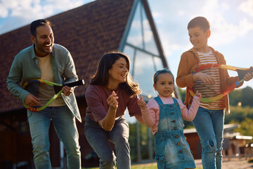 Playful family having fun together outdoors.