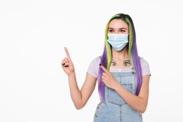 Pandemic concept. Caucasian young teenage hipster girl wearing protective face mask against...