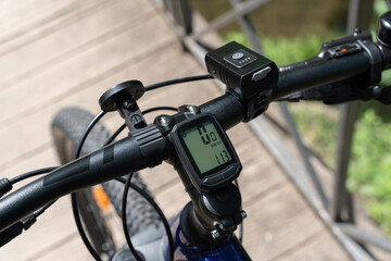 Close-up of mountain bicycle handlebar with bike computer