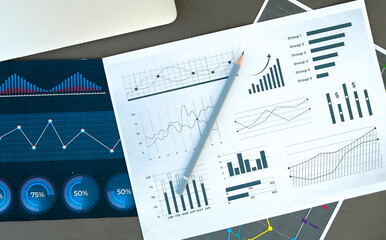 Financial accounting stock market graphs, pen, analysis
