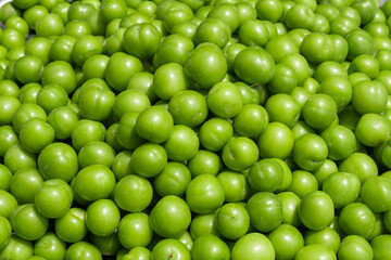 Delicious green and juicy plums at the market